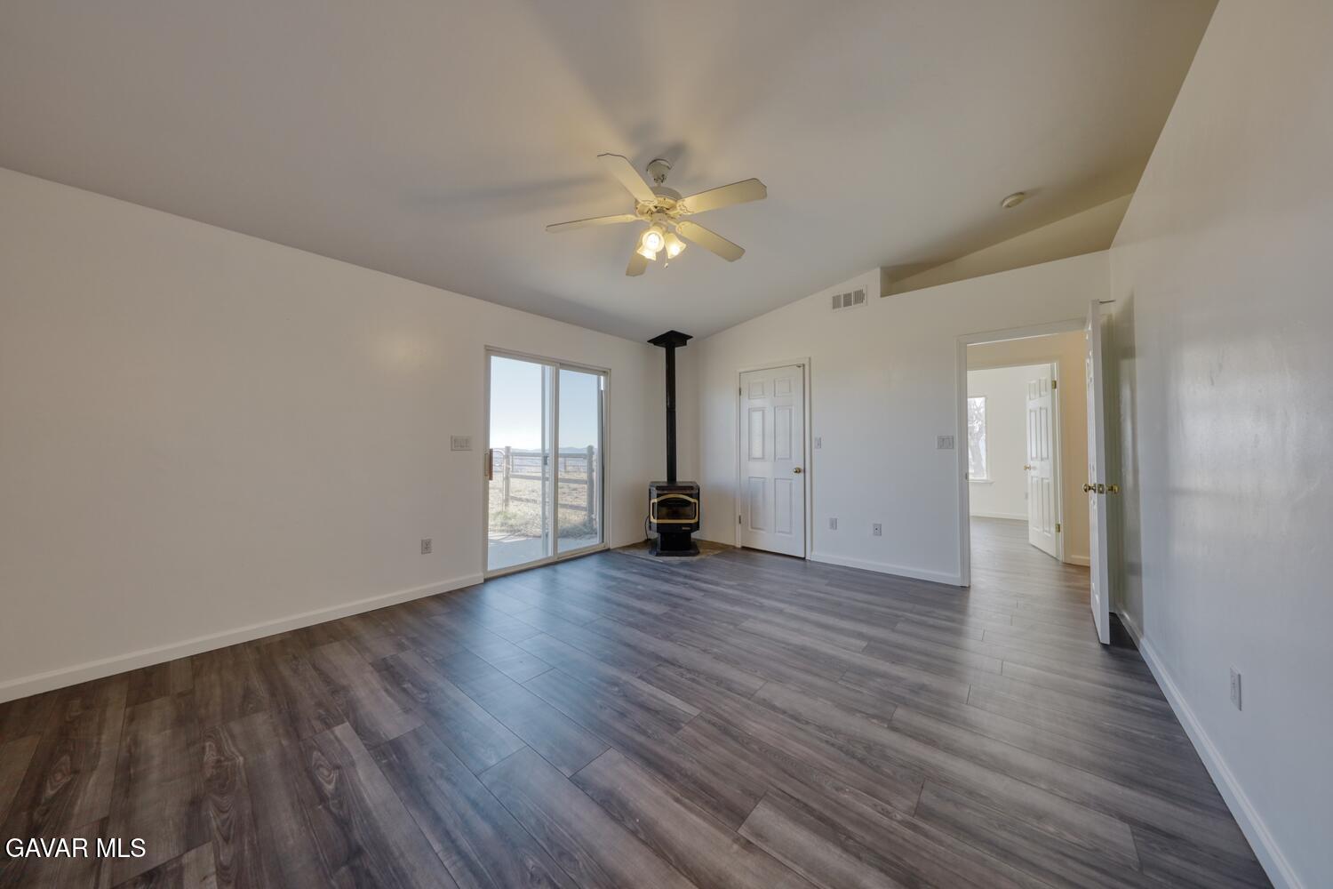 26801 Cabriolet Court Tehachapi, CA 93561 - Photo 23 of 60 a view of empty room with wooden floor and fan