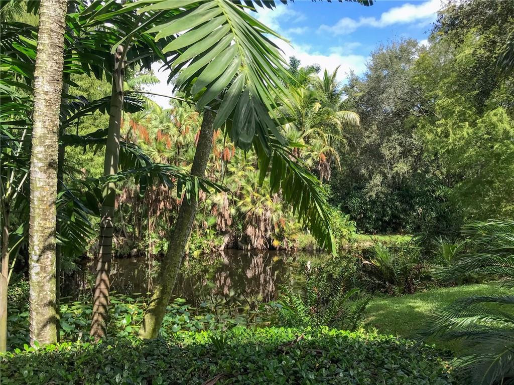 5501 Southwest 198th Terrace Southwest Ranches, FL 33332 - Photo 54 of 56 a backyard of a house with lots of green space
