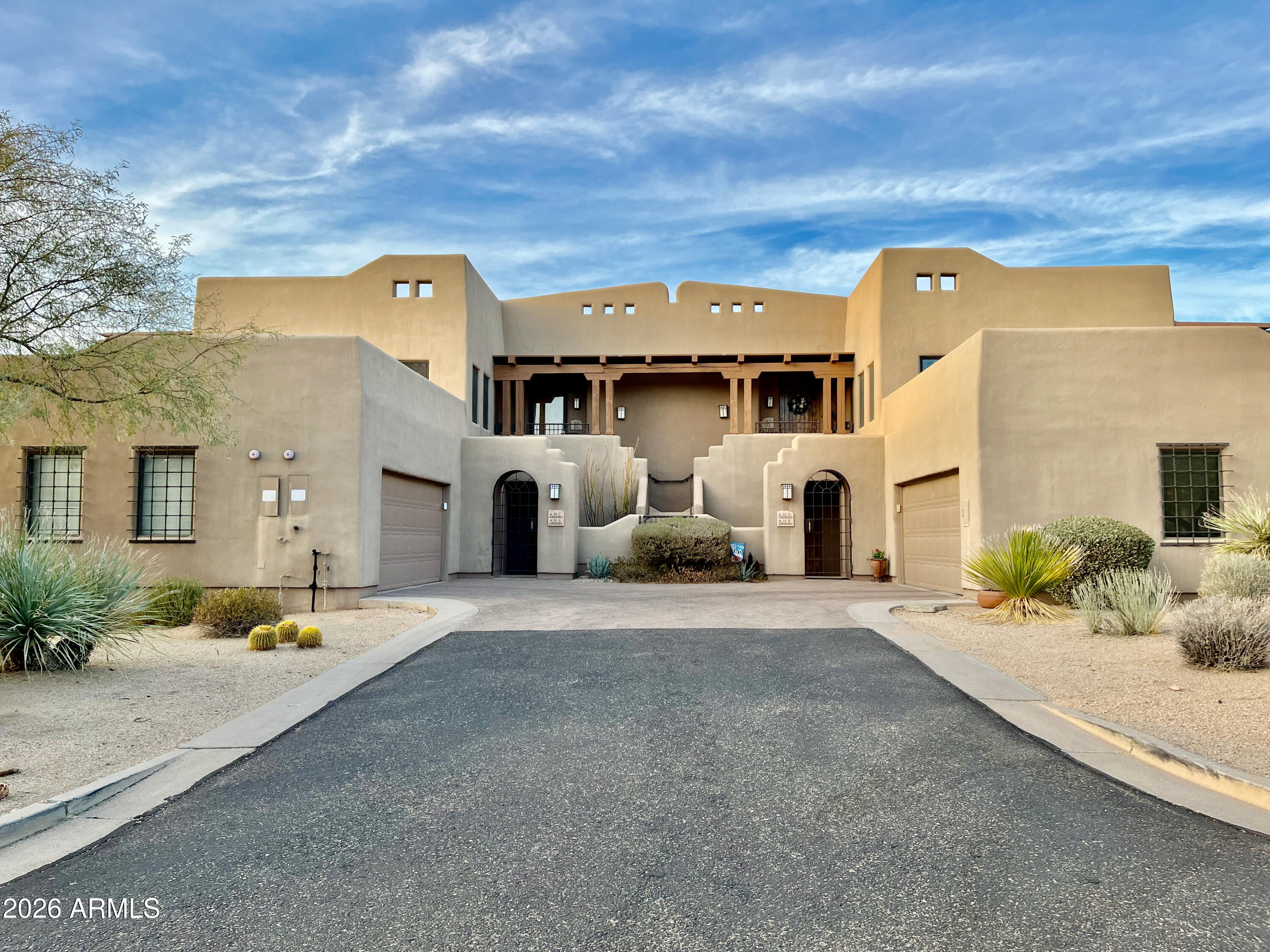 36601 North Mule Train Road, Unit C16 Carefree, AZ 85377 - Photo 1 of 38 a front view of a house with a yard