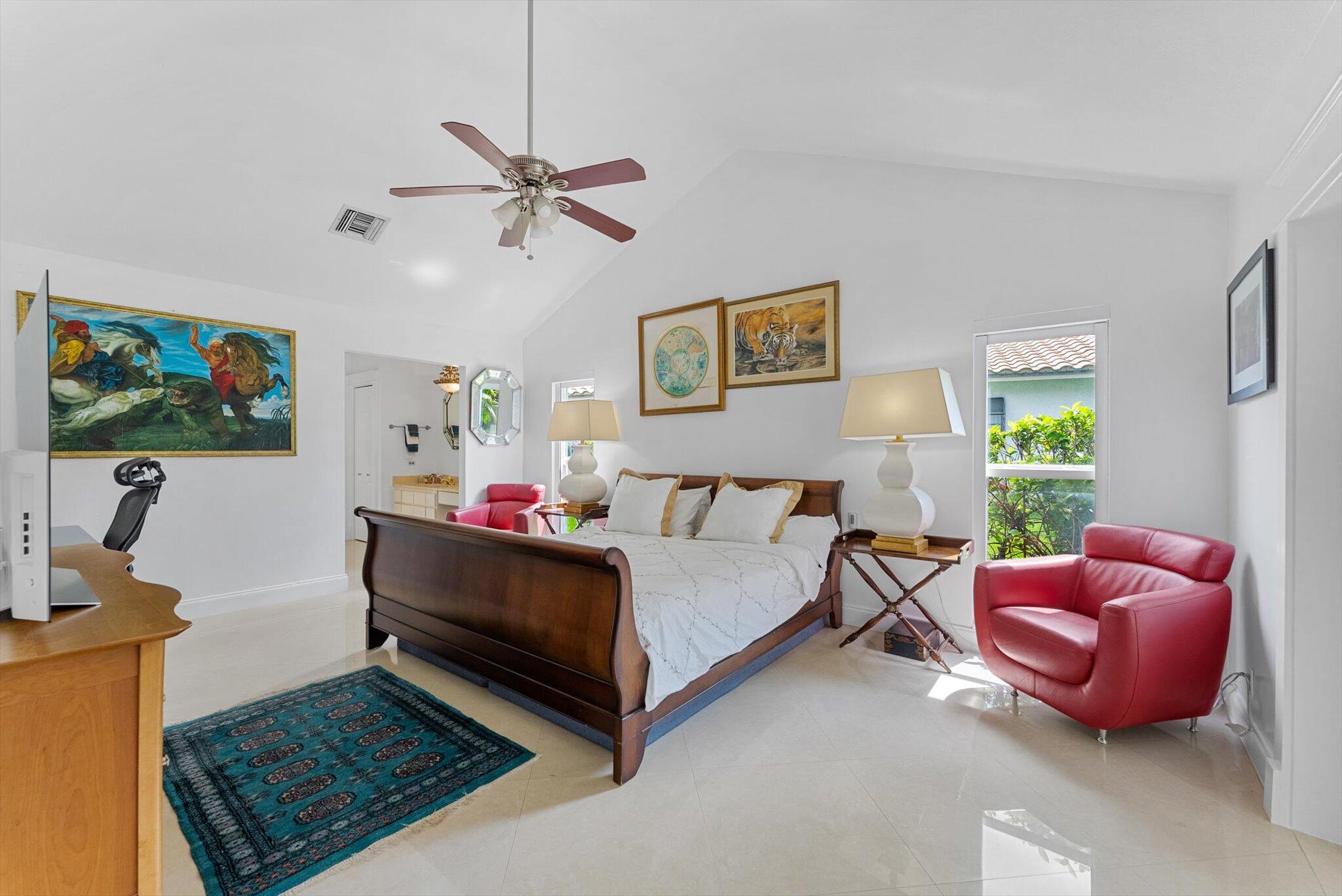 10167 Camelback Lane Boca Raton, FL 33498 - Photo 12 of 55 a bed room with a bed window and a flat screen tv