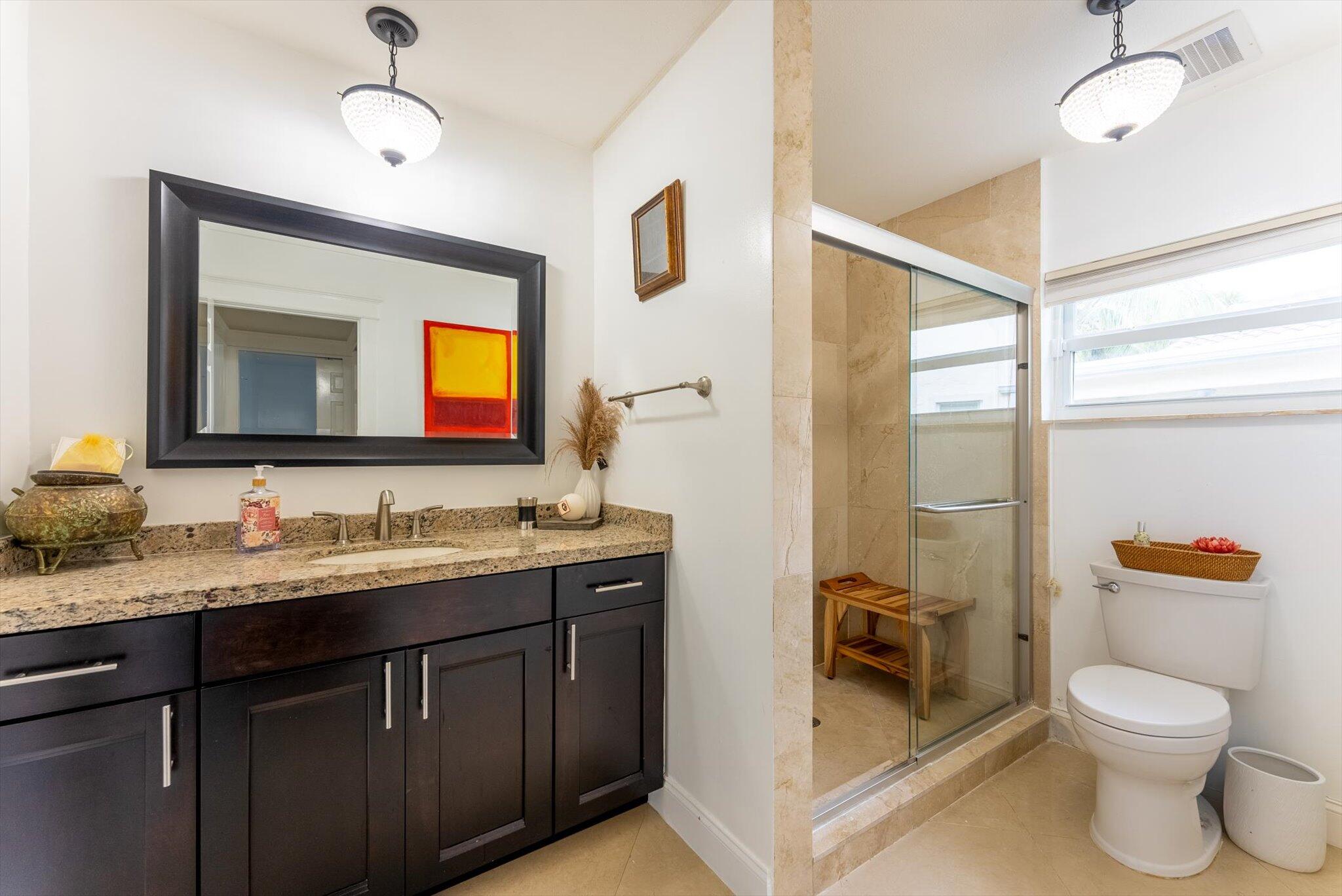 10167 Camelback Lane Boca Raton, FL 33498 - Photo 25 of 55 a bathroom with a toilet a sink and a large mirror