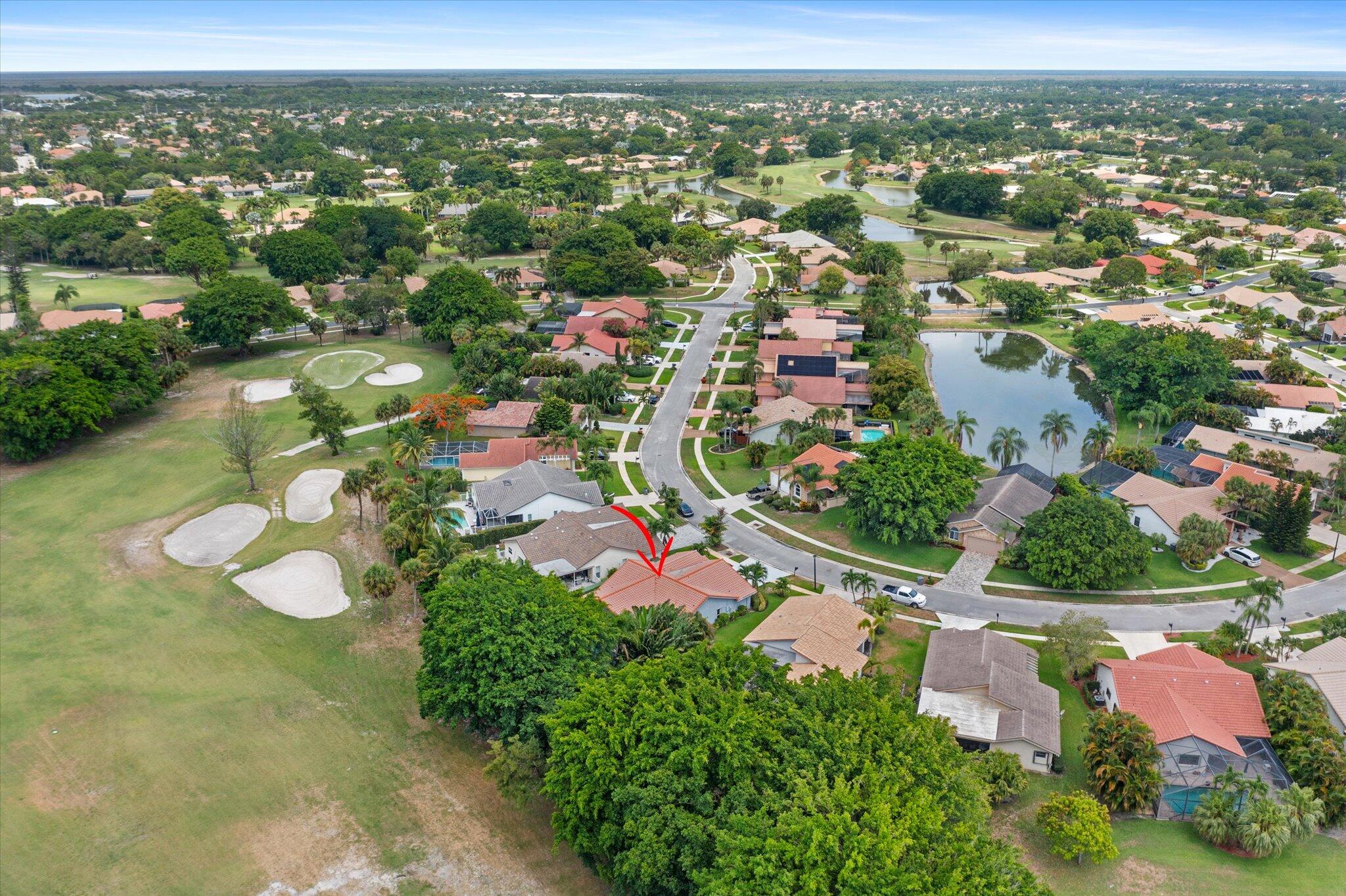 10167 Camelback Lane Boca Raton, FL 33498 - Photo 46 of 55 an aerial view of residential houses with outdoor space and trees