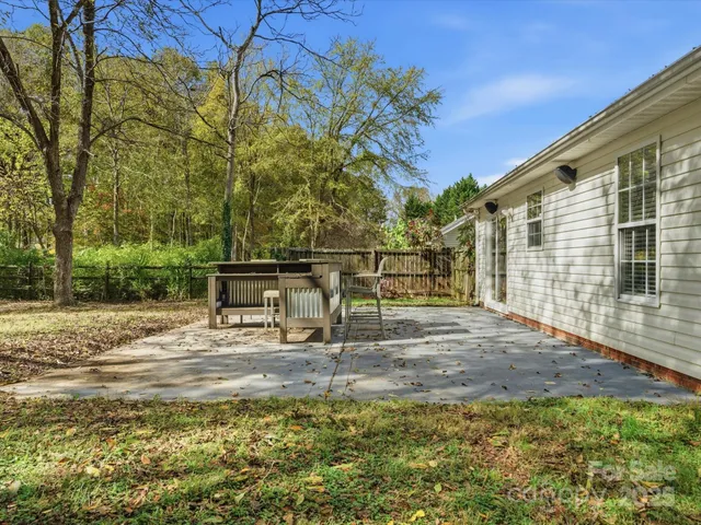 a view of a backyard with sitting area
