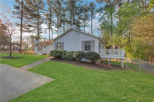 a backyard of a house with seating space