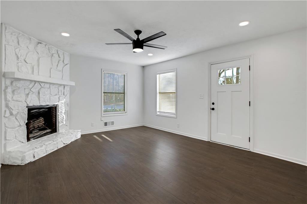 1000 Mathews Court, Unit B Smyrna, GA 30080 - Photo 15 of 42 a view of an empty room with a fireplace and a window