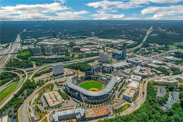 an aerial view of residential houses with outdoor space