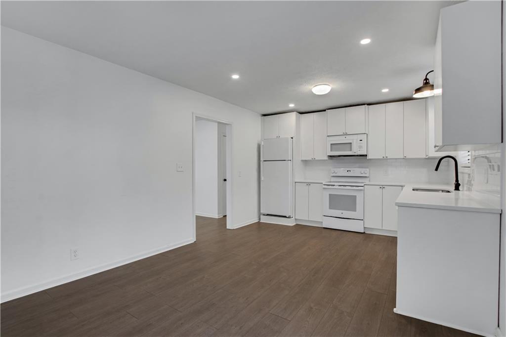 1000 Mathews Court, Unit B Smyrna, GA 30080 - Photo 25 of 42 a view of a kitchen with electric appliances