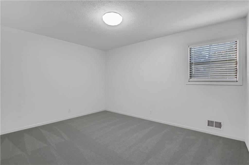 1000 Mathews Court, Unit B Smyrna, GA 30080 - Photo 28 of 42 an empty room with a window