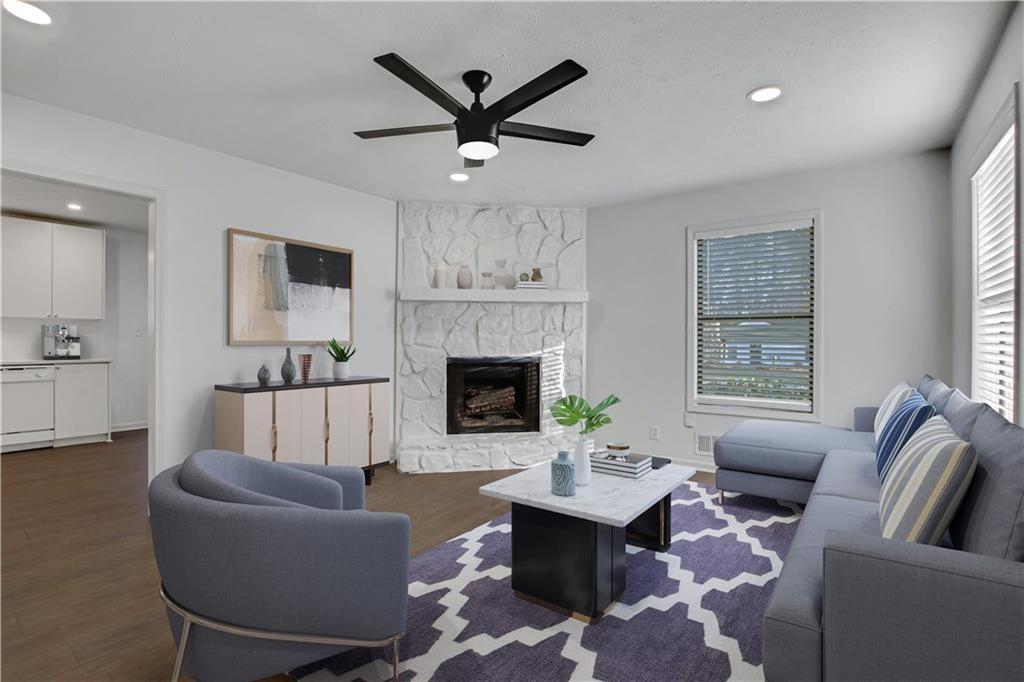 1000 Mathews Court, Unit B Smyrna, GA 30080 - Photo 3 of 42 a living room with furniture a fireplace and a large window