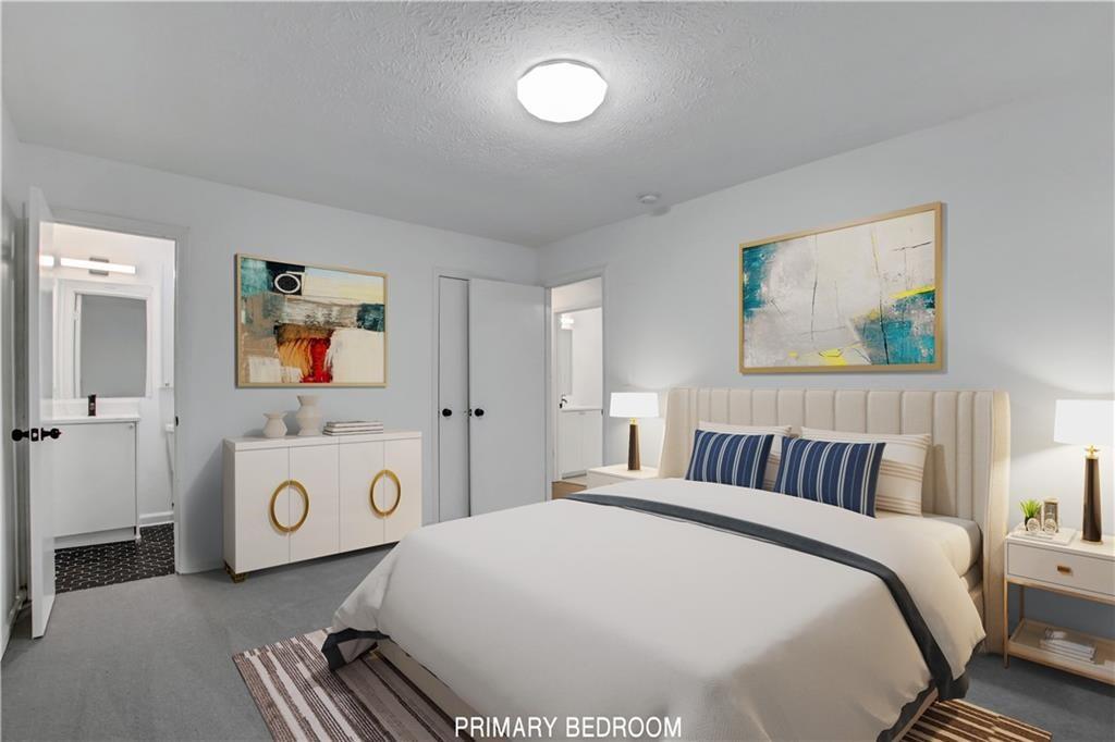 1000 Mathews Court, Unit B Smyrna, GA 30080 - Photo 4 of 42 a bedroom with a bed and a painting on the wall