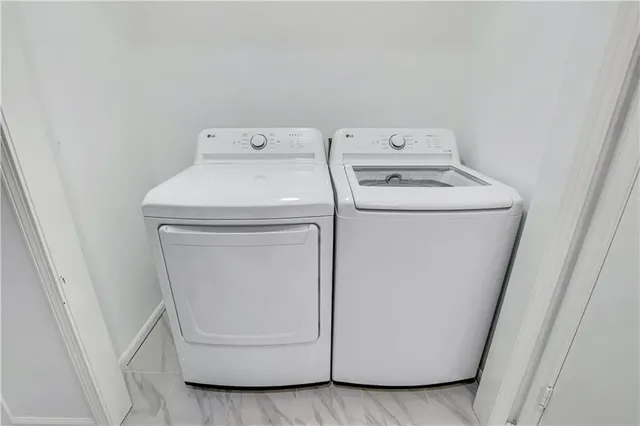a utility room with dryer and washer