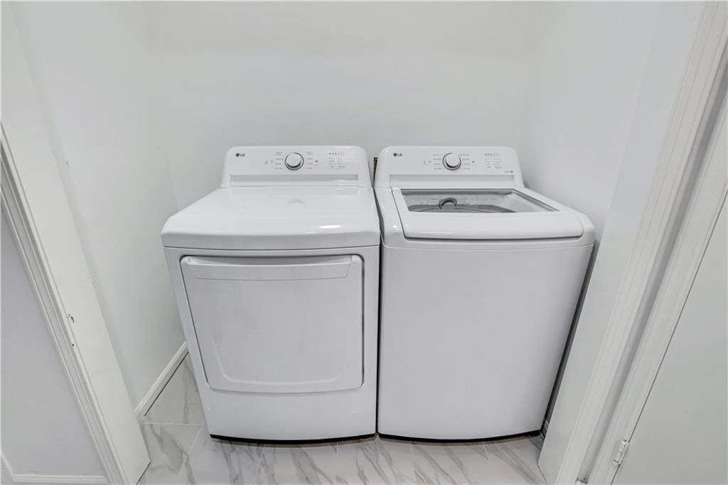 1000 Mathews Court, Unit B Smyrna, GA 30080 - Photo 5 of 42 a utility room with dryer and washer