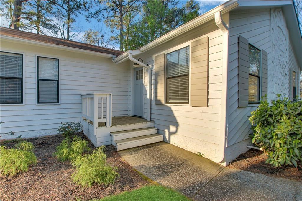 1000 Mathews Court, Unit B Smyrna, GA 30080 - Photo 8 of 42 a view of a house with backyard and a tree