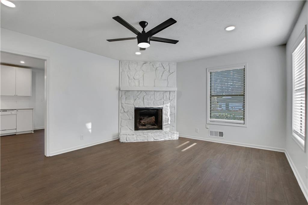 1000 Mathews Court, Unit B Smyrna, GA 30080 - Photo 9 of 42 an empty room with windows and fireplace