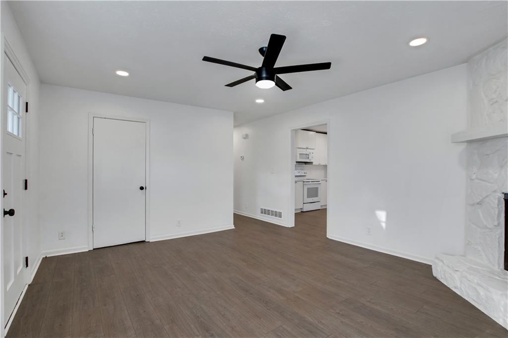 1000 Mathews Court, Unit B Smyrna, GA 30080 - Photo 10 of 42 a view of an empty room with a ceiling fan