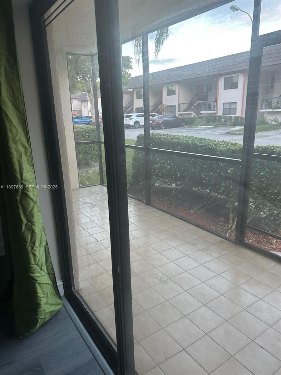 855 Northeast 209th Street, Unit 10334 Miami, FL 33179 - Photo 17 of 38 a bathroom with a glass door shower and sink