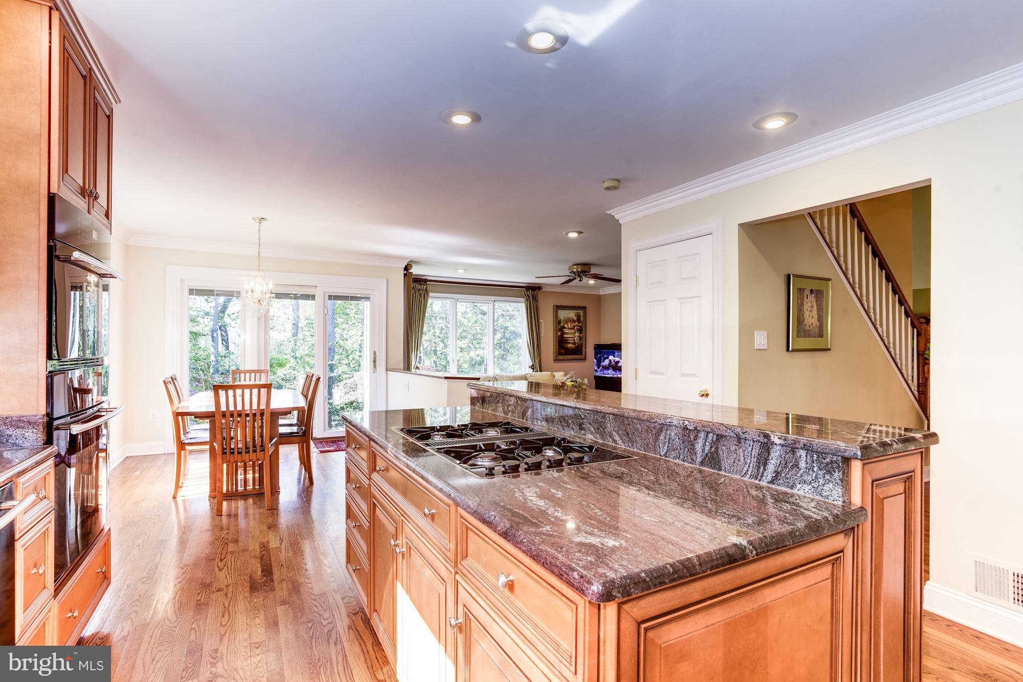 1300 Pavilion Club Way Reston, VA 20194 - Photo 30 of 30 a kitchen with stainless steel appliances granite countertop a stove and a sink
