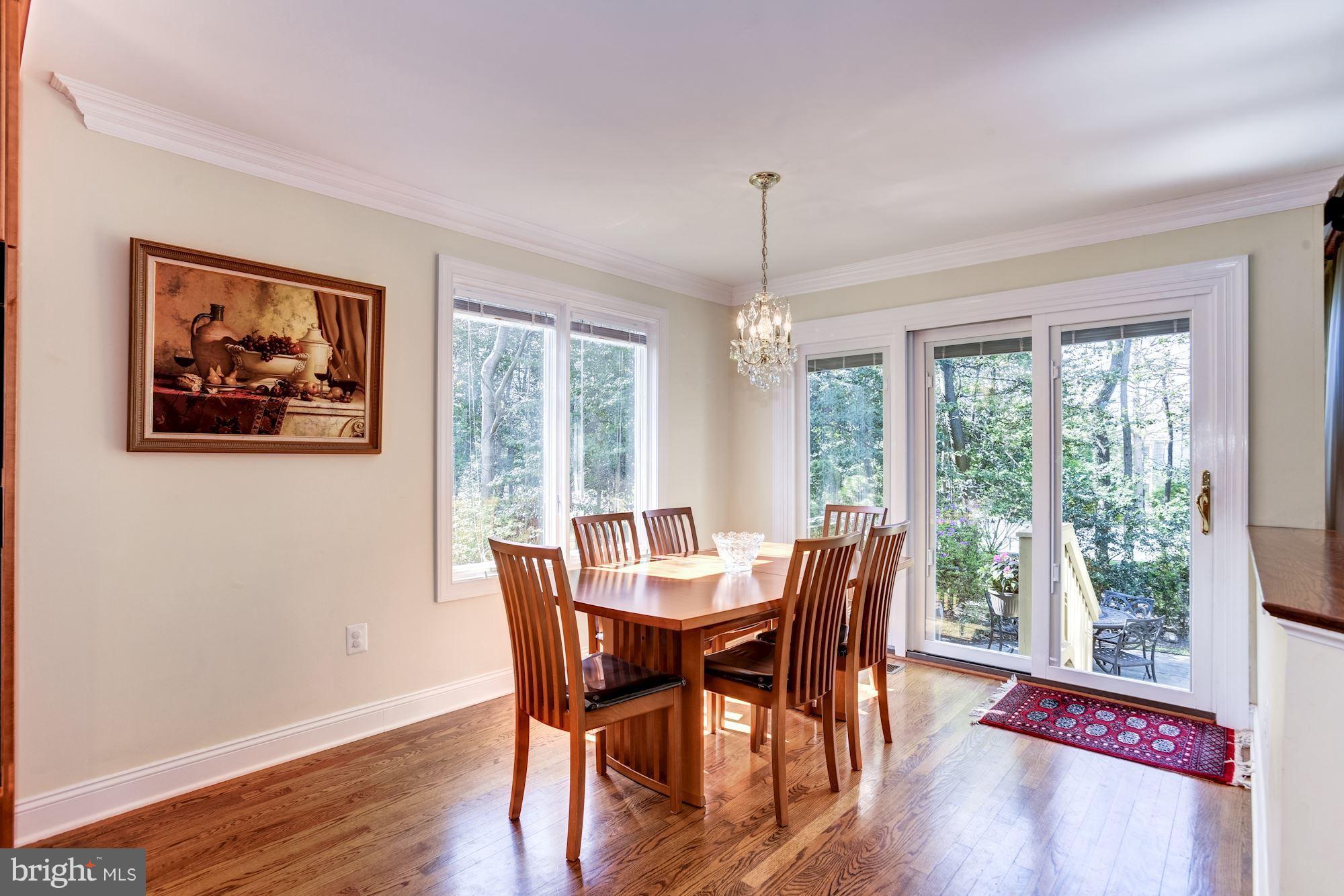 1300 Pavilion Club Way Reston, VA 20194 - Photo 10 of 30 a view of a dining room with furniture window and wooden floor