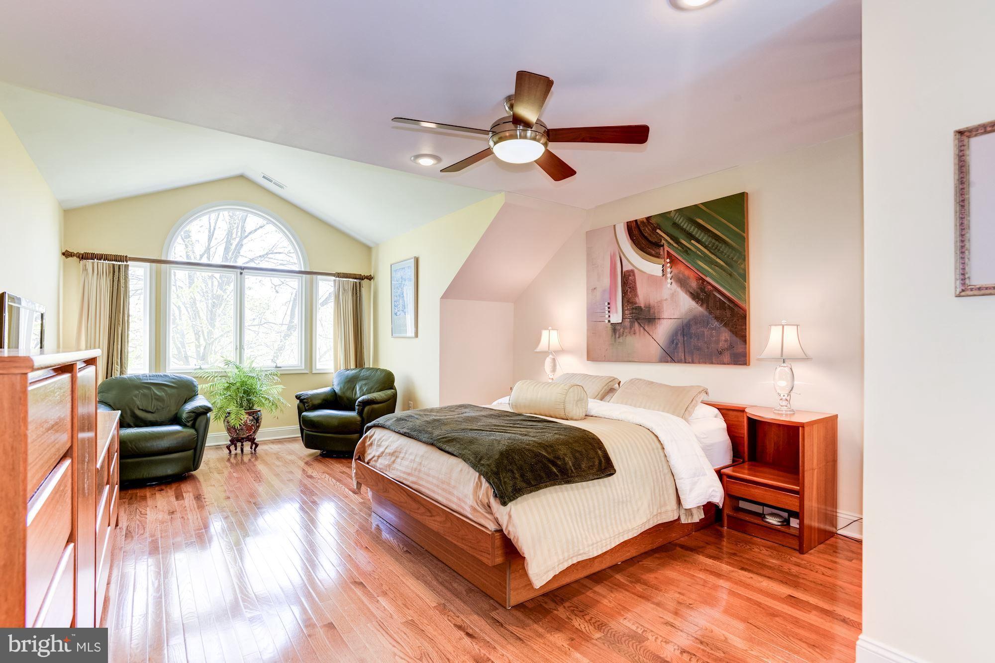 1300 Pavilion Club Way Reston, VA 20194 - Photo 15 of 30 a spacious bedroom with a bed and a large window