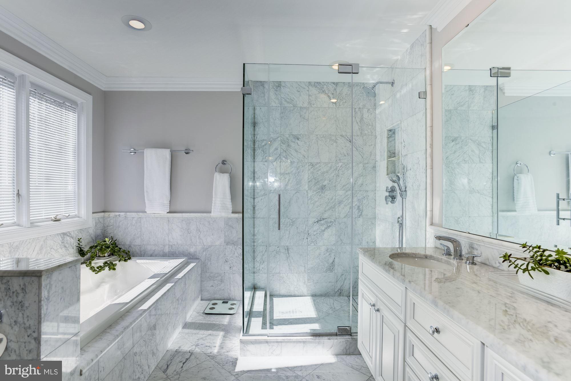 1300 Pavilion Club Way Reston, VA 20194 - Photo 17 of 30 a bathroom with a granite countertop bathtub shower sink and mirror