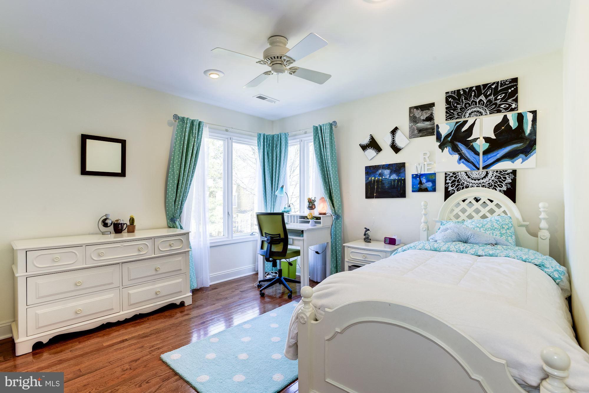 1300 Pavilion Club Way Reston, VA 20194 - Photo 18 of 30 a bedroom with a bed and wooden floor