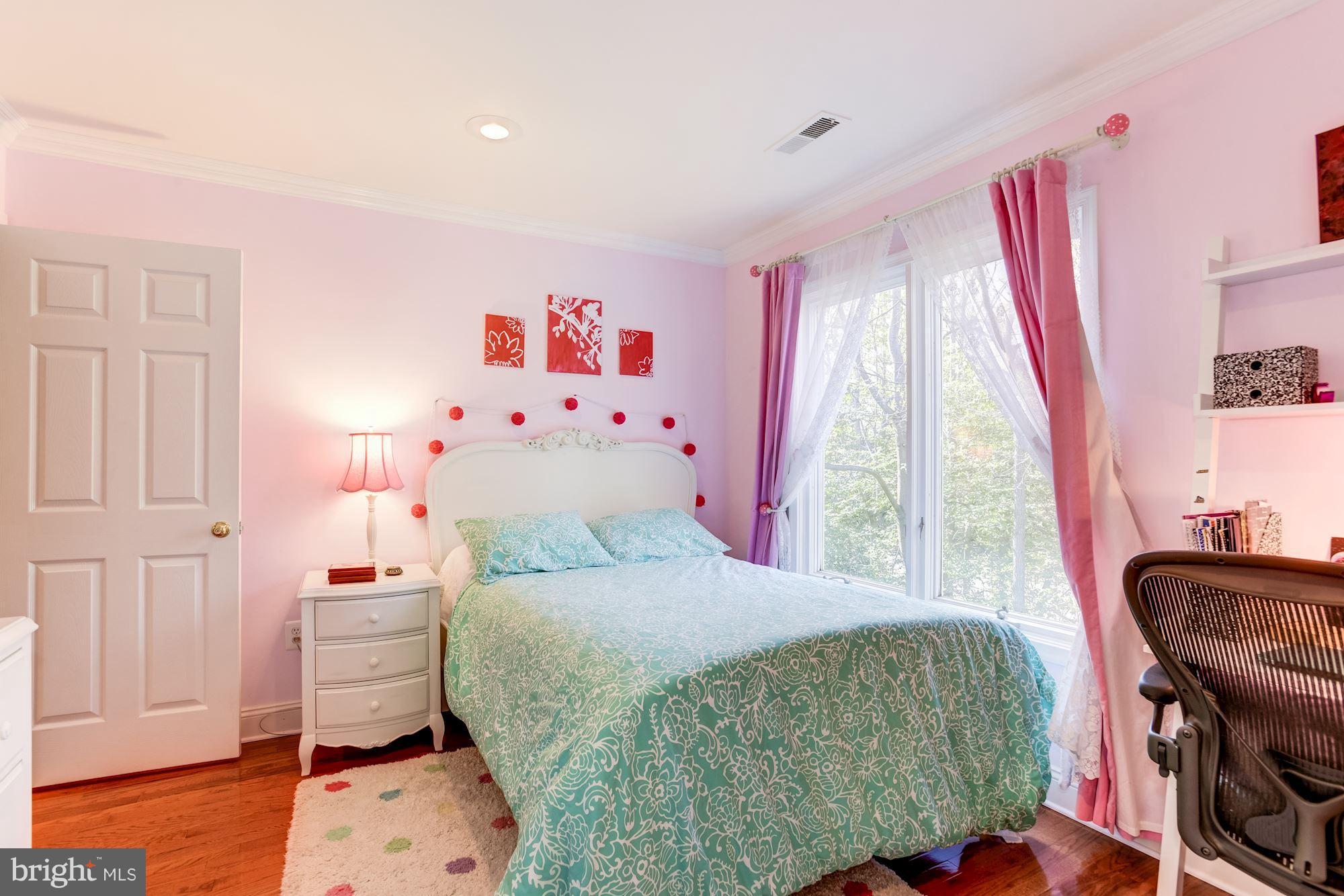 1300 Pavilion Club Way Reston, VA 20194 - Photo 21 of 30 a bedroom with a bed and wooden floor