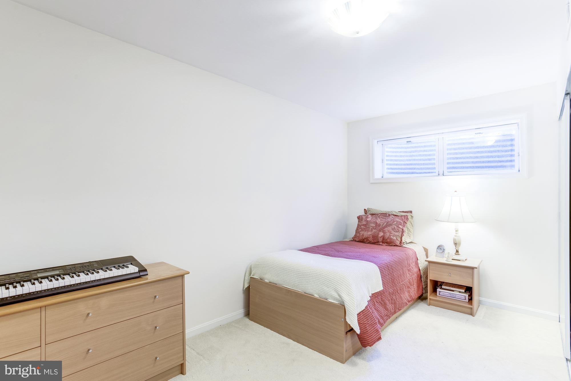 1300 Pavilion Club Way Reston, VA 20194 - Photo 25 of 30 a bedroom with a bed and a dresser