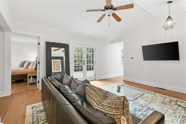 a living room with furniture and a flat screen tv