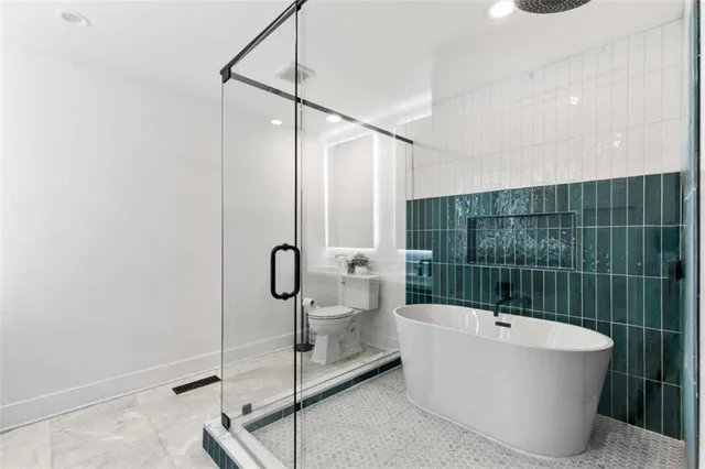 a bathroom with a bathtub and shower