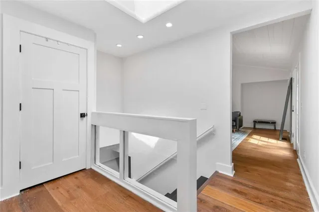 a view of a livingroom with furniture and hardwood floor
