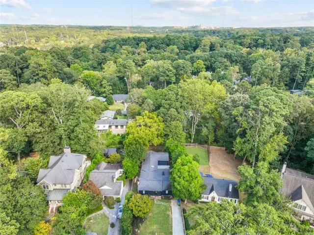 an aerial view of a house with lots of trees