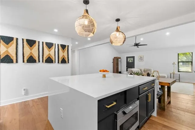 a kitchen with a stove and a table