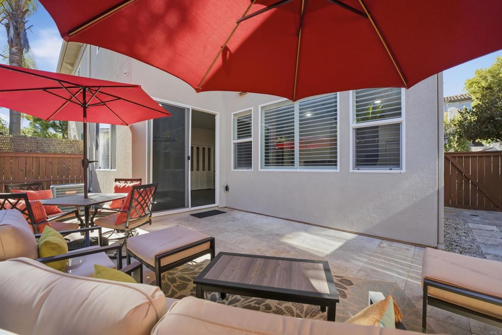 2284 Durango Way, Unit 200 San Marcos, CA 92078 - Photo 12 of 39 an outdoor sitting area with furniture and umbrella