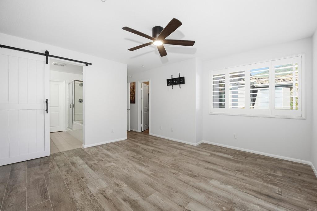 2284 Durango Way, Unit 200 San Marcos, CA 92078 - Photo 15 of 39 a view of empty room with wooden floor and fan