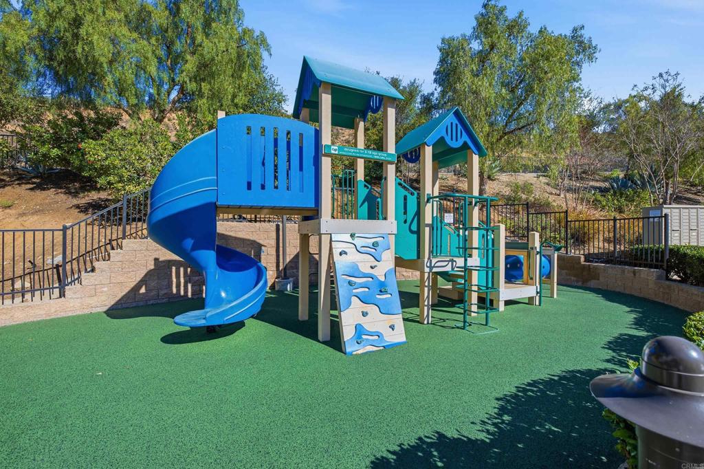 2284 Durango Way, Unit 200 San Marcos, CA 92078 - Photo 34 of 39 a view of a house with a yard and sitting area