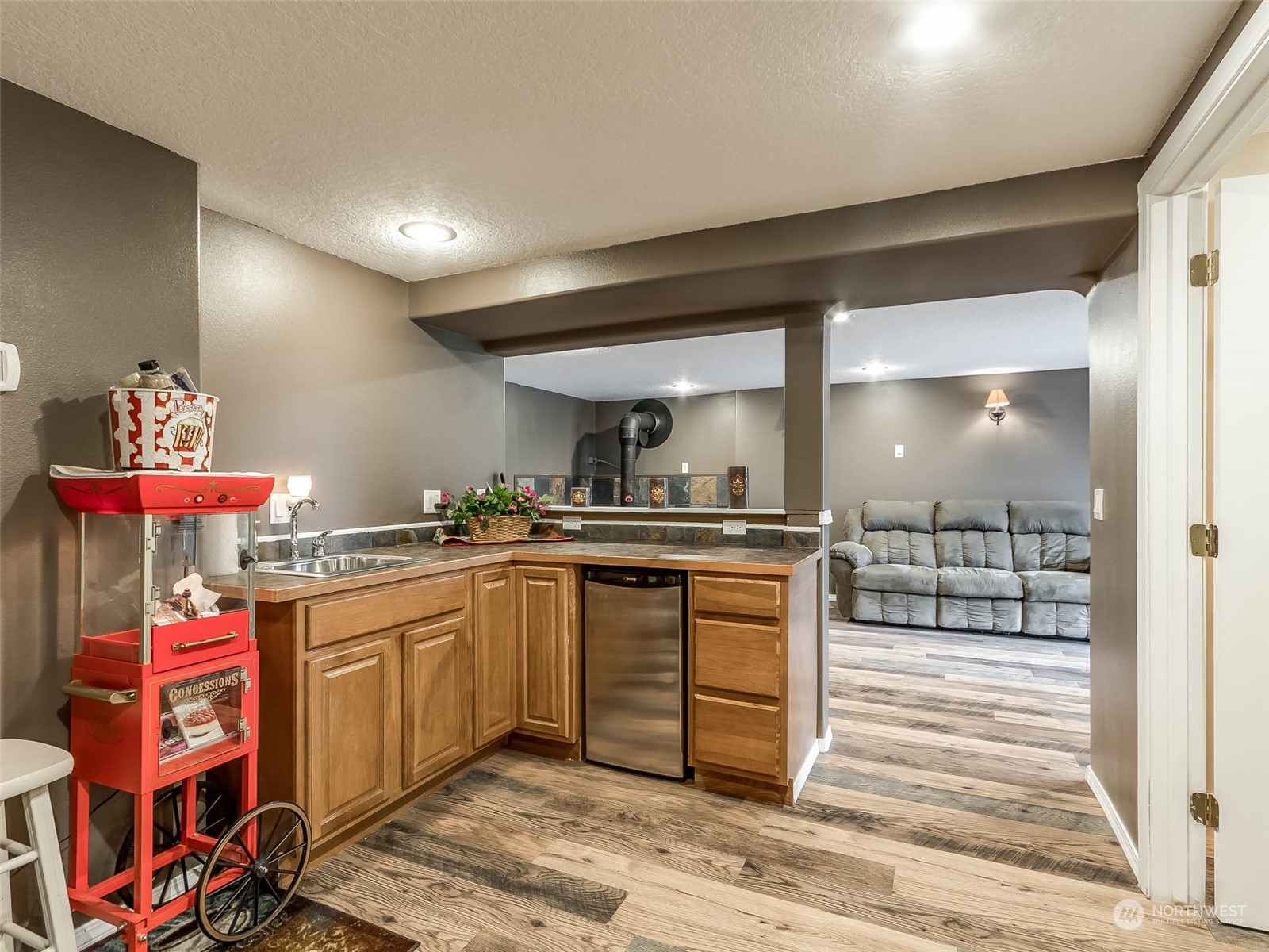 6 White Road Raymond, WA 98577 - Photo 11 of 40 a kitchen with stainless steel appliances granite countertop a sink and cabinets