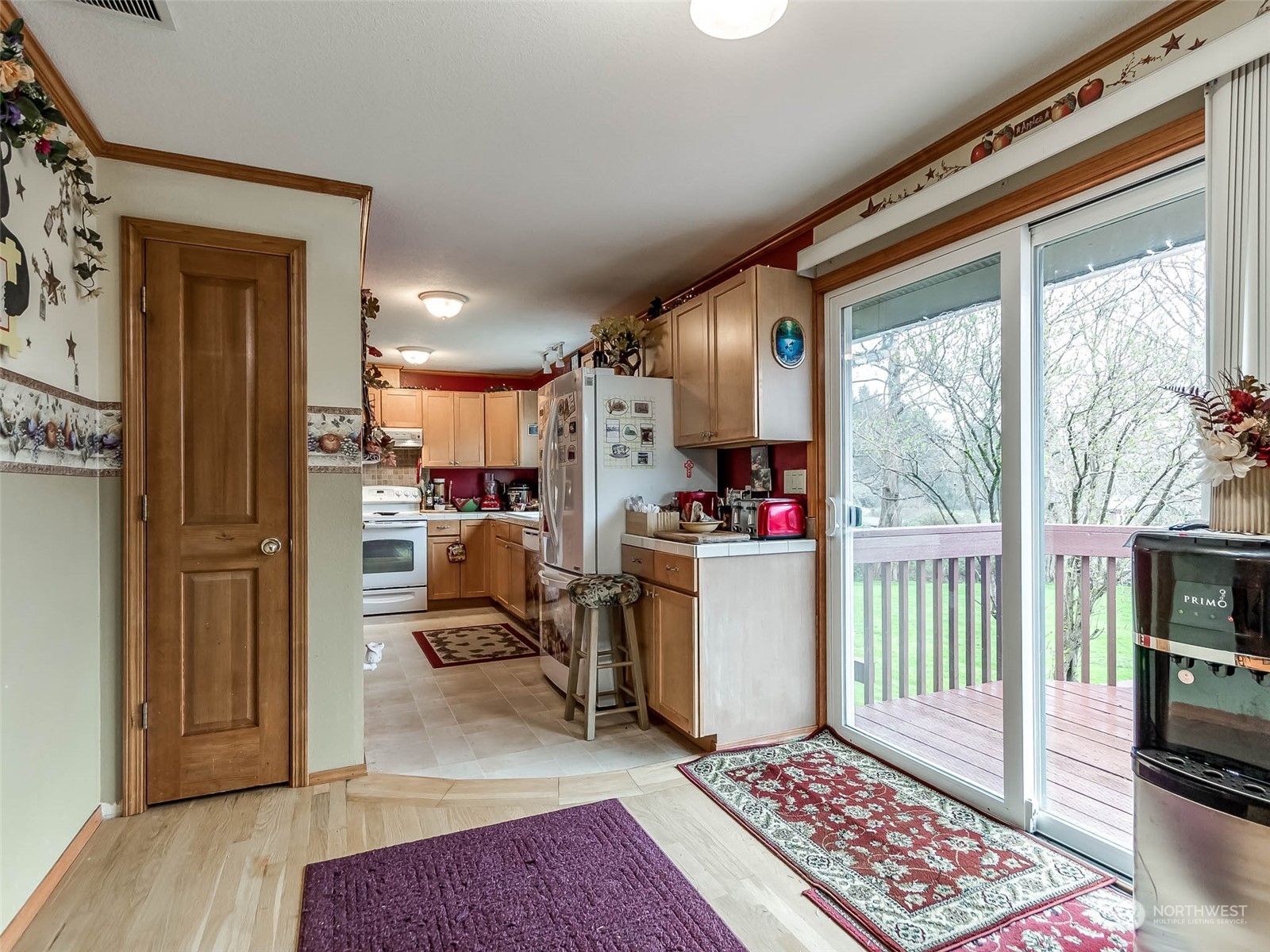 6 White Road Raymond, WA 98577 - Photo 20 of 40 a living room with furniture and a dining table with kitchen view