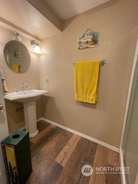 6 White Road Raymond, WA 98577 - Photo 24 of 40 a bathroom with a sink mirror and vanity