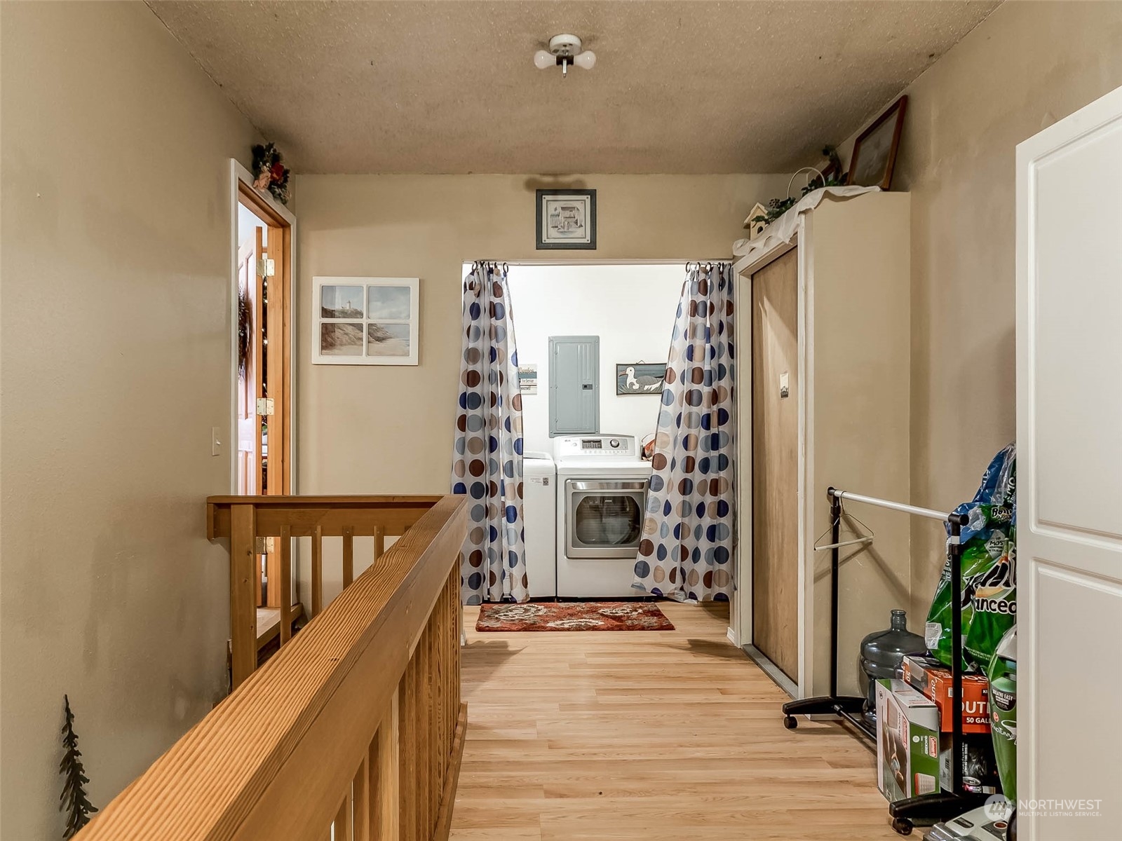 6 White Road Raymond, WA 98577 - Photo 26 of 40 a view of a hallway with wooden floor and staircase