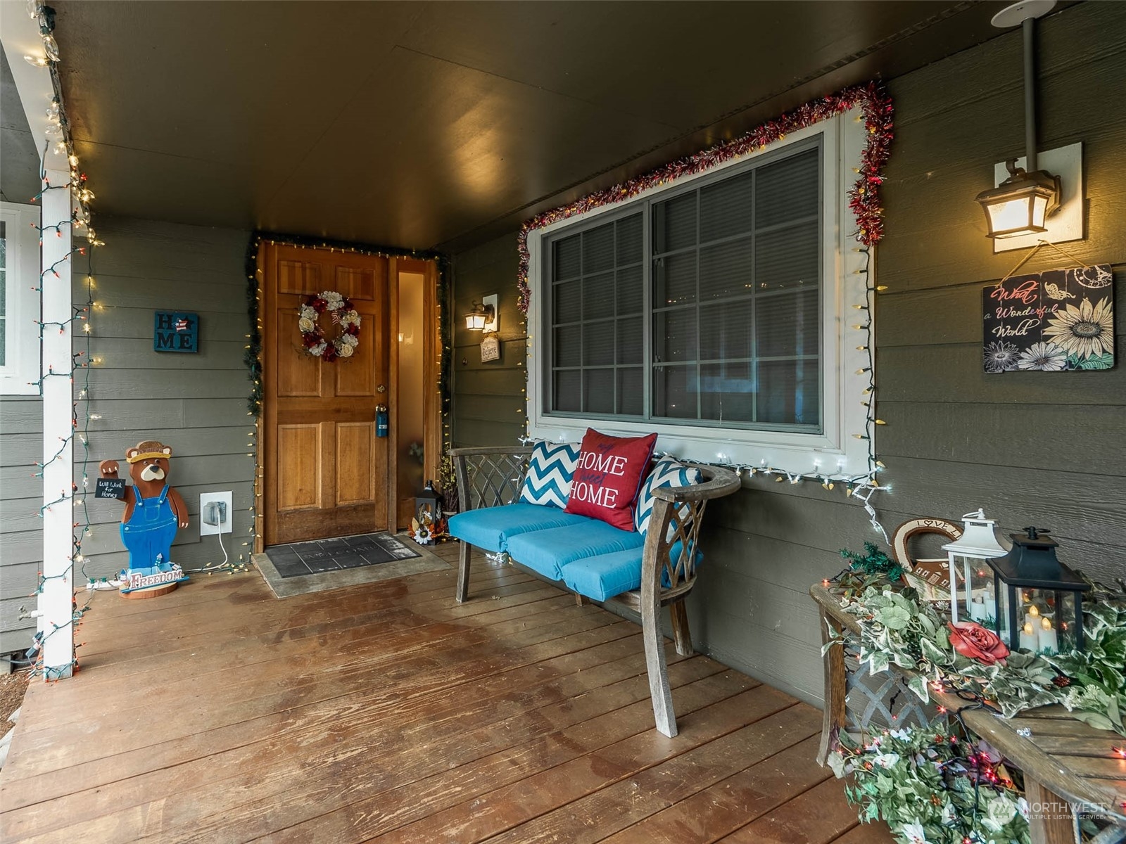 6 White Road Raymond, WA 98577 - Photo 3 of 40 a bench is sitting in front of a building