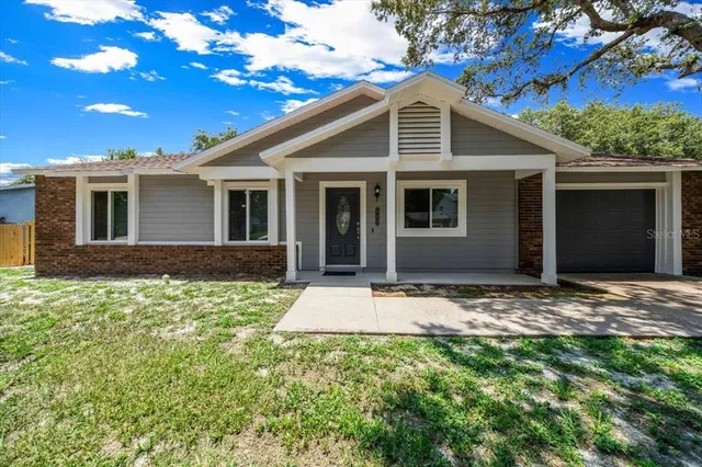 a front view of a house with yard