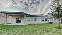 12032 Bridgehampton Road Jacksonville, FL 32218 - Photo 11 of 13 a view of a house with a yard