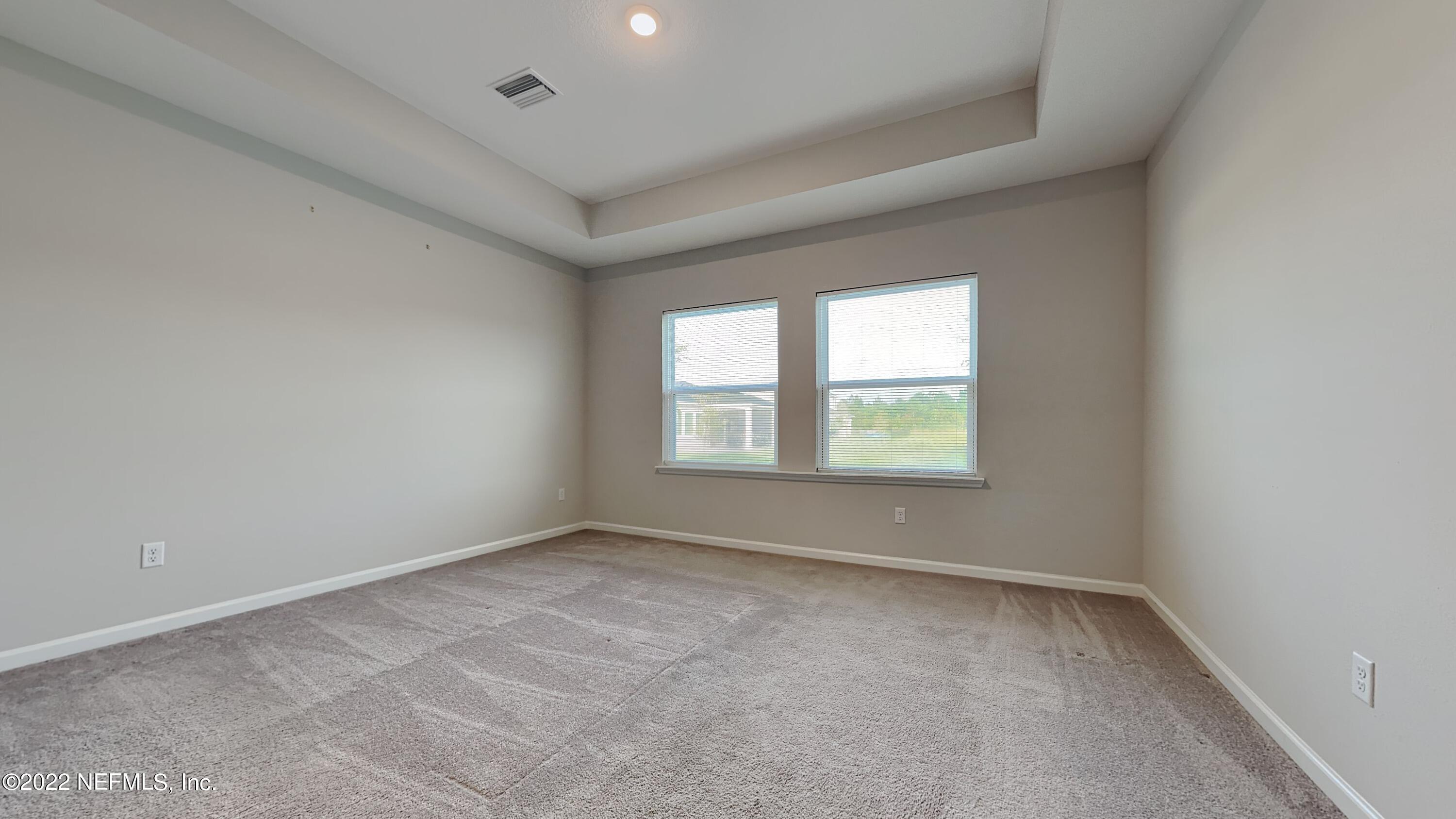 12032 Bridgehampton Road Jacksonville, FL 32218 - Photo 7 of 13 an empty room with a window