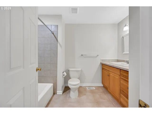 a bathroom with a toilet sink and a shower