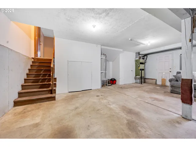 a view of kitchen and hall with wooden floor