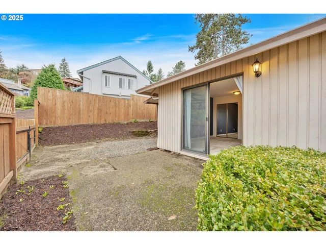 a view of a backyard of the house