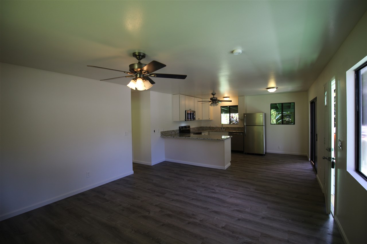 1000 Kauhikoa Road Haiku, HI 96708 - Photo 8 of 17 a view of kitchen with refrigerator and ceiling fan