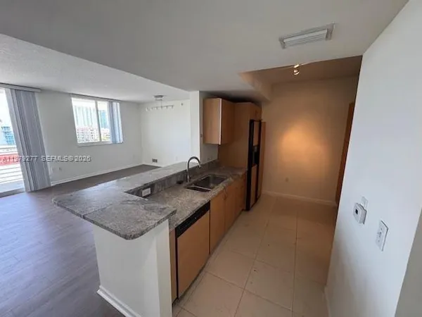 an entryway with wooden floor