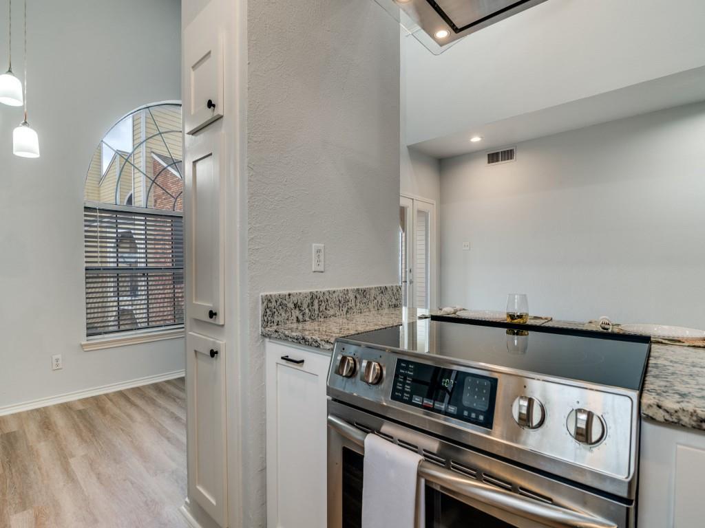 4434 Point Boulevard, Unit 208 Garland, TX 75043 - Photo 11 of 28 a view of kitchen stove and microwave