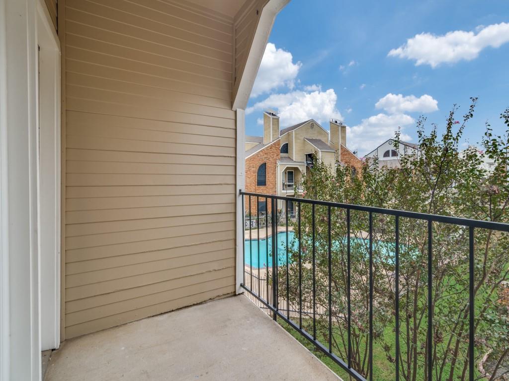 4434 Point Boulevard, Unit 208 Garland, TX 75043 - Photo 25 of 28 a view of a balcony with an outdoor space